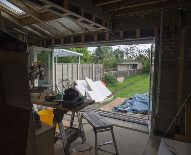 Inside a new single-storey extension with bifold doors and a roof window fitted